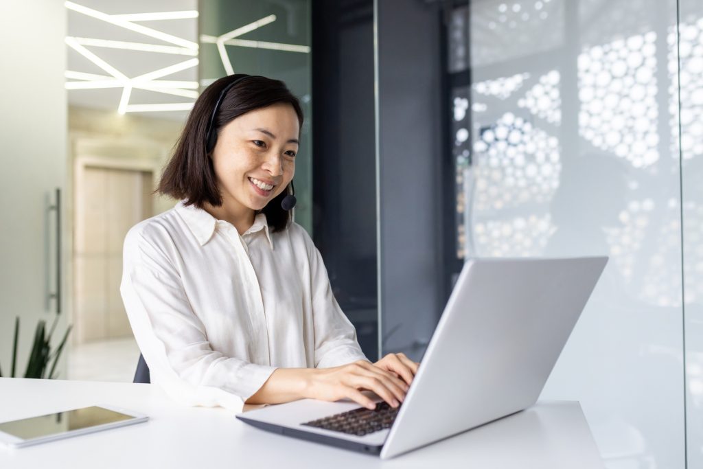 Asian female online customer support customer service worker at workplace inside office, woman